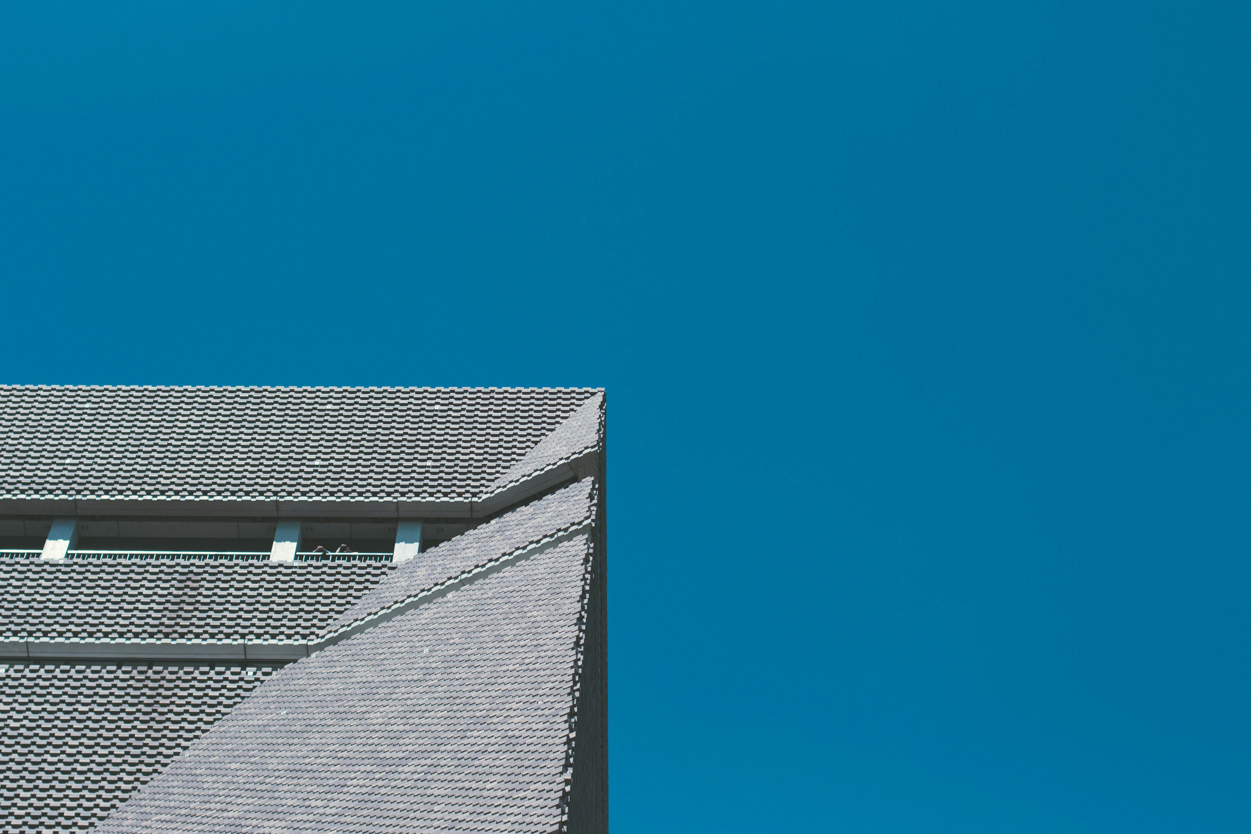 gray concrete building in low angle photography at daytime